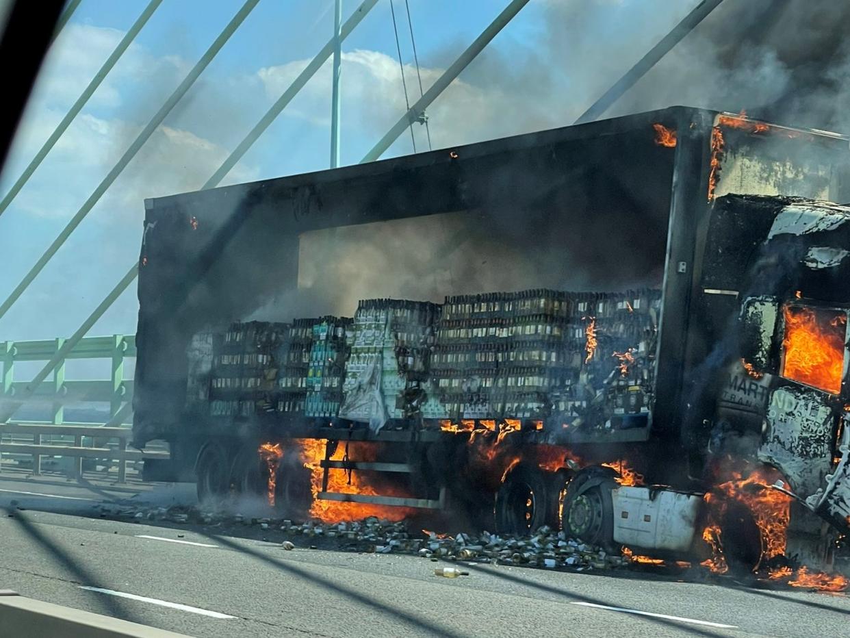 The wine bottles are seen inside the lorry. 