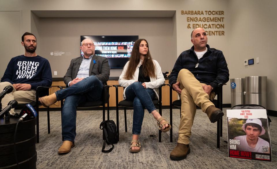 From left, Daniel Lifshitz, Dori Roberts, Ella Shani and Nir Shani speak at a press conference at the Dell Jewish Community Center on Nov. 16. Four speakers with relatives held hostage by Hamas took questions from local media.