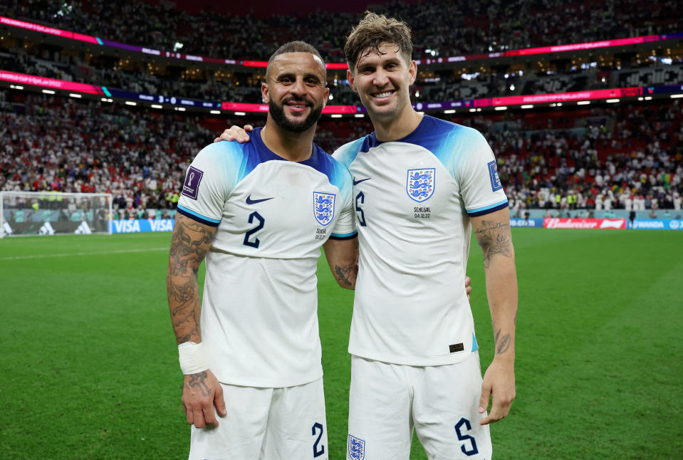AL KHOR, QATAR - DECEMBER 04: Kyle Walker and John Stones of England pose for a photo following the FIFA World Cup Qatar 2022 Round of 16 match between England and Senegal at Al Bayt Stadium on December 04, 2022 in Al Khor, Qatar. (Photo by Eddie Keogh - The FA/The FA via Getty Images)