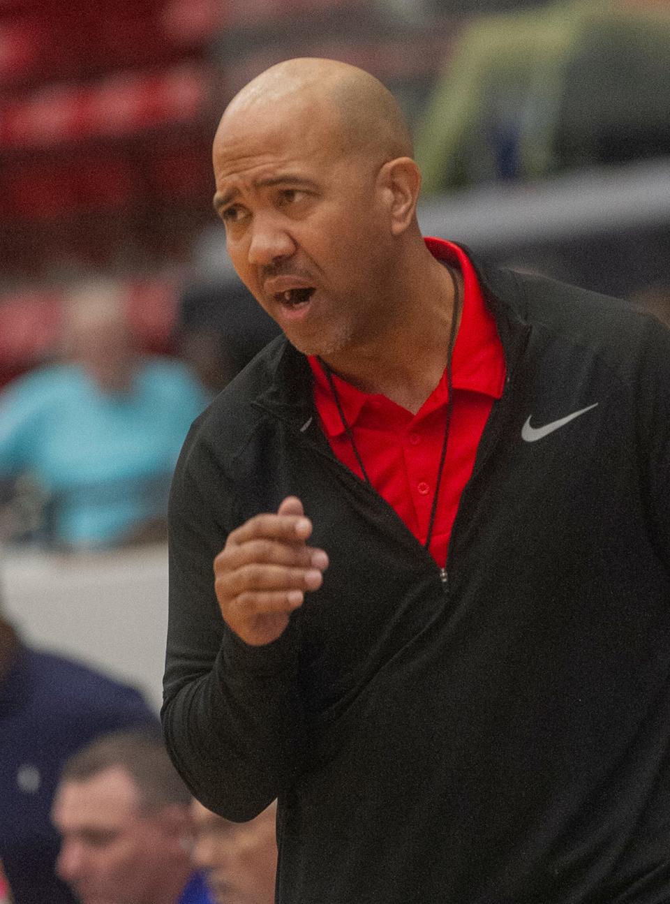 Cardinal Mooney High School Head Basketball Coach Marlon Williams instructs his players against King's Academy during their FHSAA Girls 3A girls semifinal basketball game at The RP Funding Center in Lakeland Wednesday. February 22, 2023. (SPECIAL TO THE PALM BEACH POST/MICHAEL WILSON)