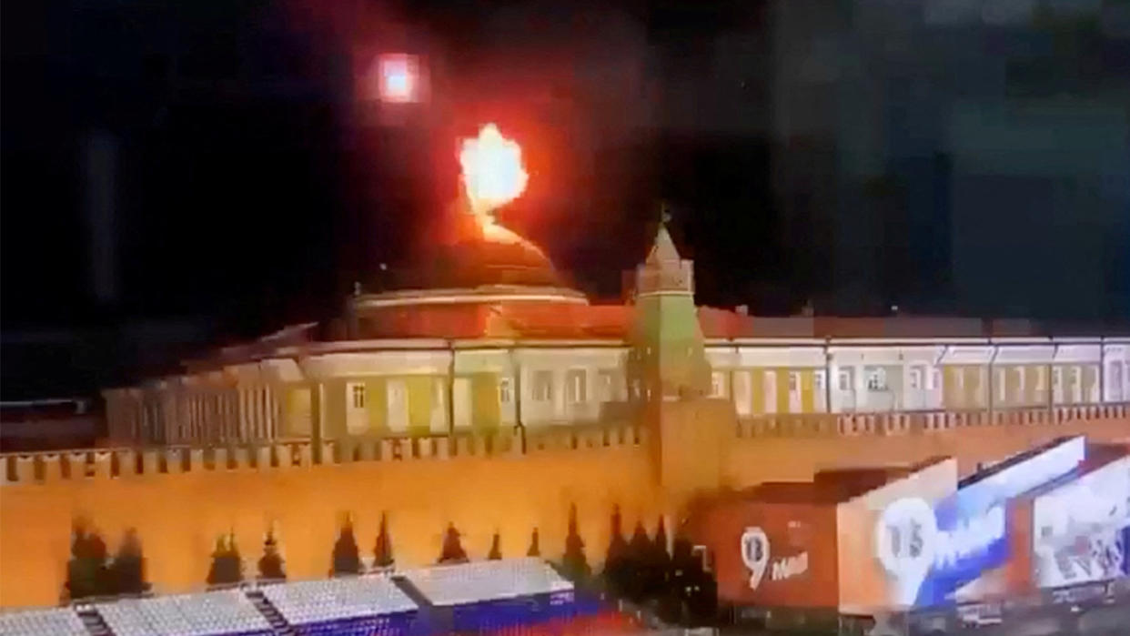 An image taken from video shows an explosion near the dome of the Kremlin Senate during an alleged Ukrainian drone attack in Moscow