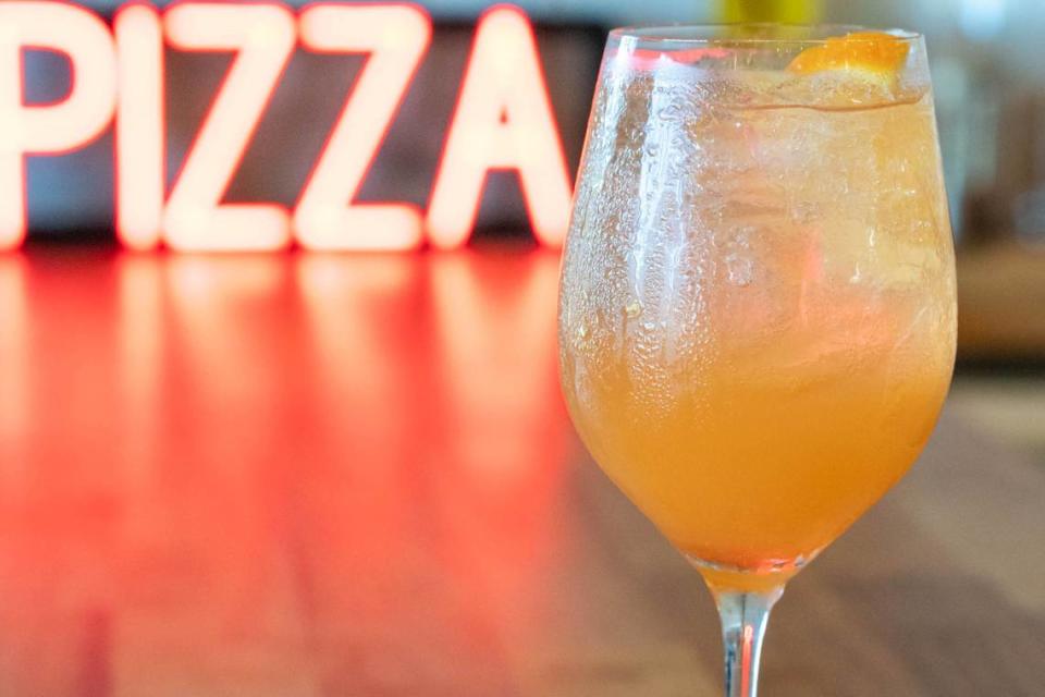 A Pizza Baby cocktail called Train to Trentino with Cappelletti aperitivo, Cointreau, orange juice, sparkling rosé and soda.