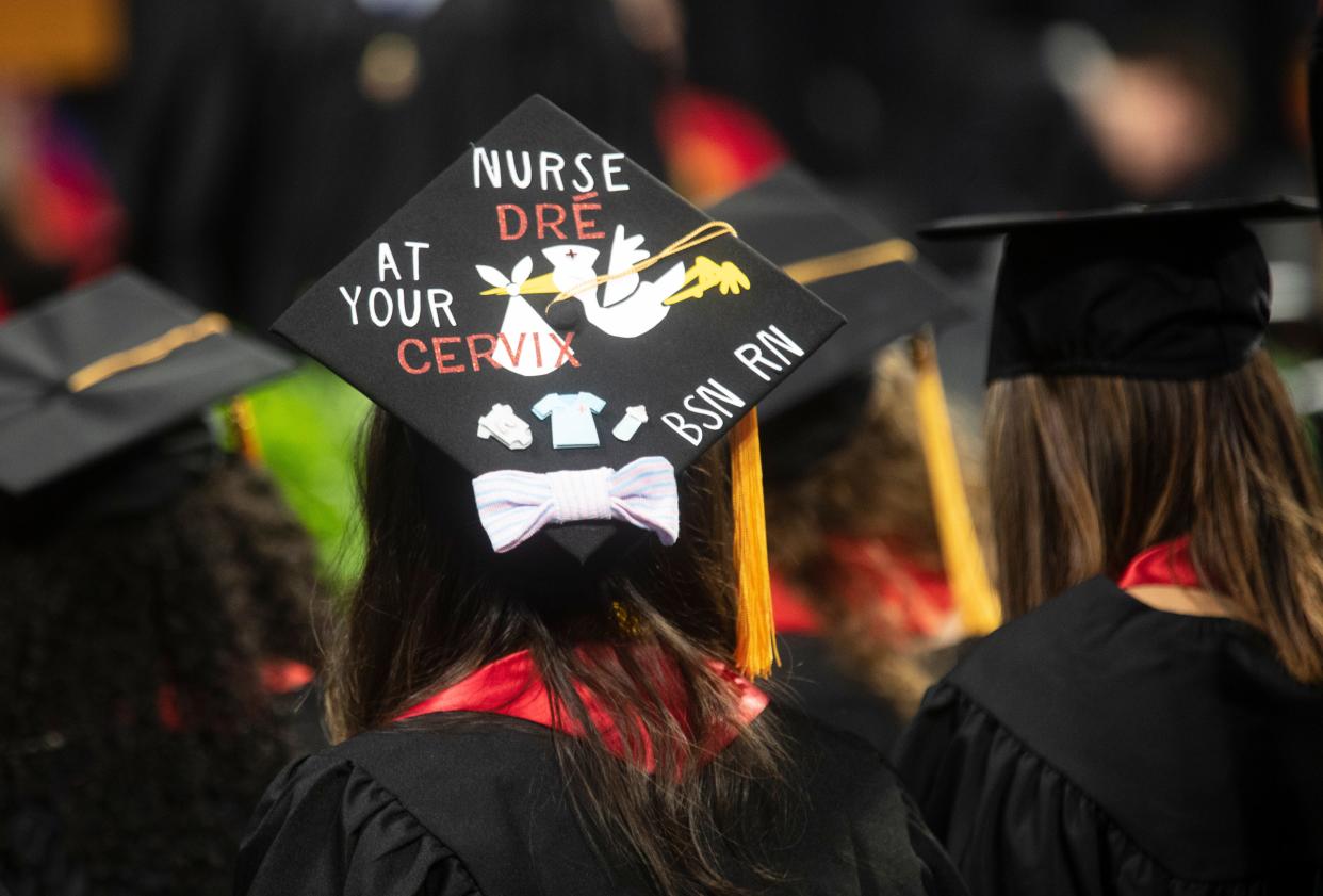 University of Cincinnati graduates participate in graduation at Fifth Third Arena, Friday, April 29, 2022. UC graduated a record 7,080 students over two days at Fifth Third Arena. On this day, graduates were from the colleges of Allied Health Sciences, Engineering and Applied Science, Medicine and Nursing.