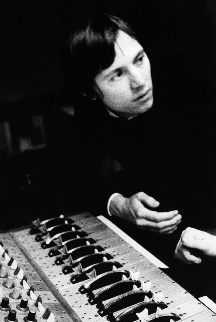 Sandy Roberton, leaning over mixing desk (Photo by Estate Of Keith Morris/Redferns) - Credit: Redferns