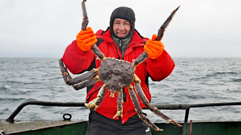 Man holding red king crab