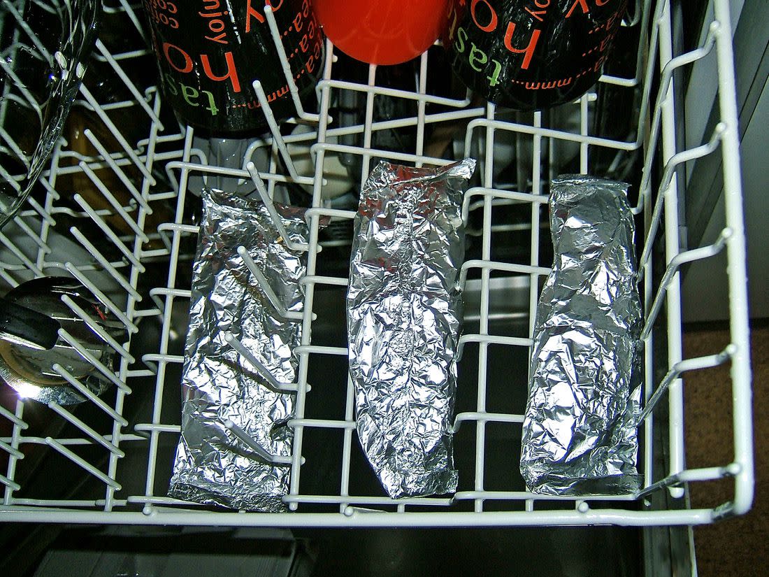 Fish packed into aluminium foil and poached in the dishwasher