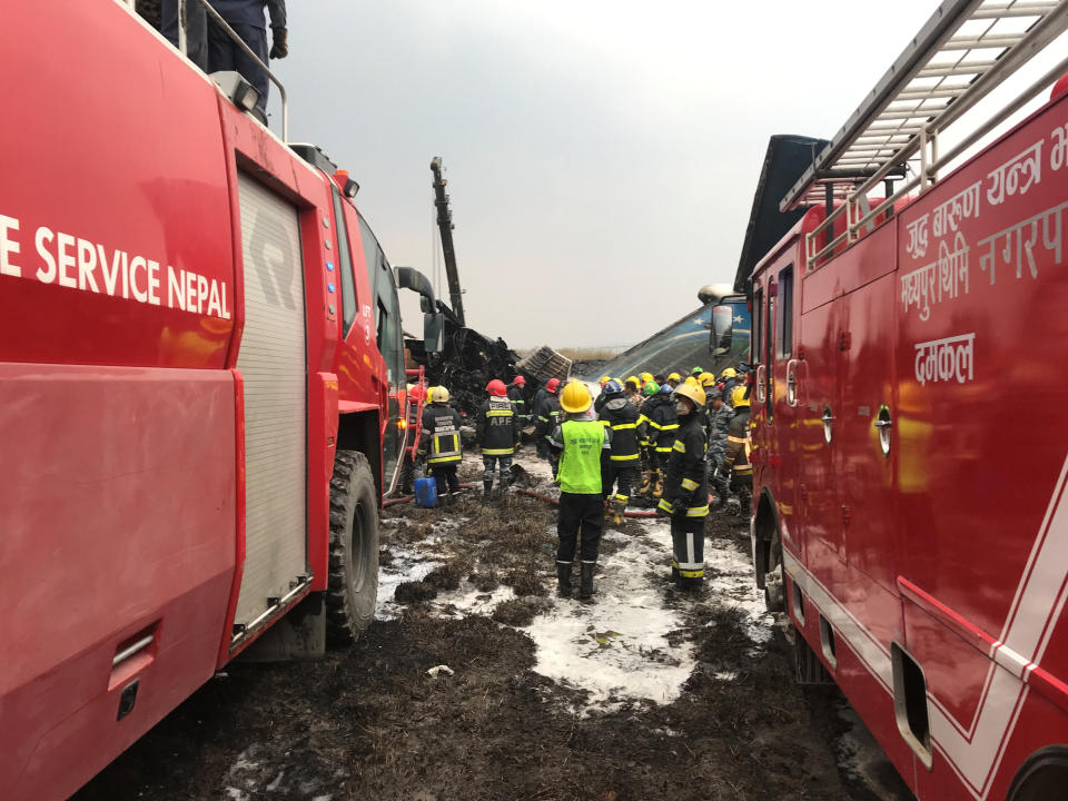 <p>Wreckage of an airplane is pictured as rescue workers operate at Kathmandu airport, Nepal, March 12, 2018. (Photo: Navesh Chitrakar/Reuters) </p>