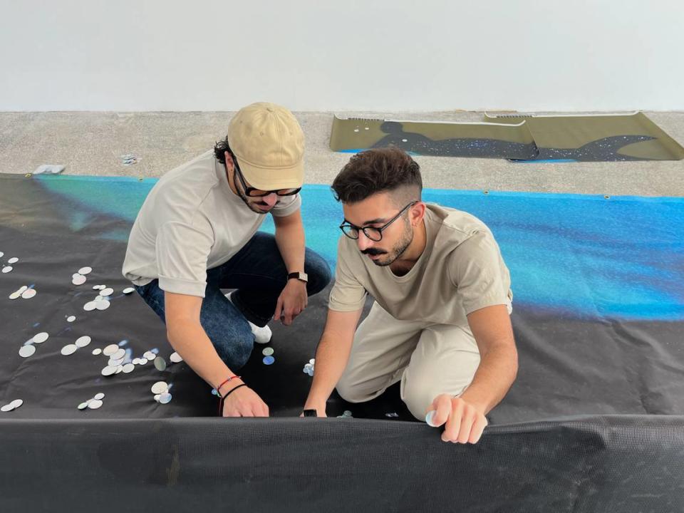 Elliot and Erick Jiménez working on their “Reclining Mermaid” public artwork ahead of Miami Art Week.