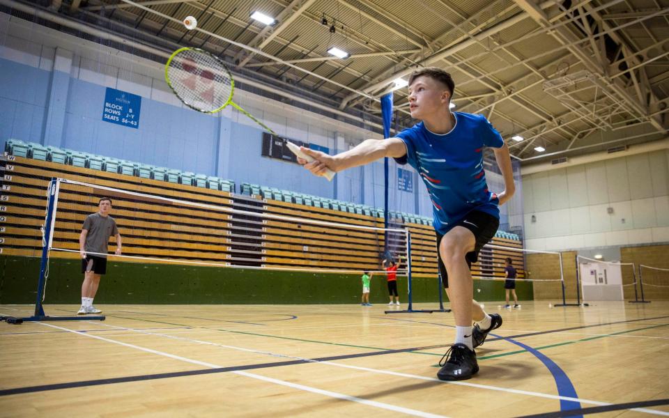  Badminton player, Dylan Saunders (aged 15) from Winchester enjoys getting back on court during an Indoor Sports Collective Day  - PA