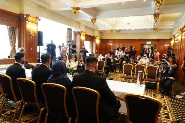 Solictor Aamer Anwar  with brothers, Muhammad Amaad, 25, (right) Fahir Amaaz, 19, and thier mother Shameem Akhtar, 56, facing the media during a press conference at the Midland Hotel in Manchester