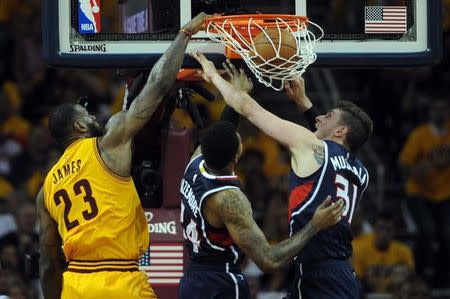 Cleveland Cavaliers forward LeBron James (23) dunks over Atlanta Hawks forward Mike Muscala (31) during the third quarter in game three of the Eastern Conference Finals of the NBA Playoffs at Quicken Loans Arena. Mandatory Credit: Ken Blaze-USA TODAY Sports