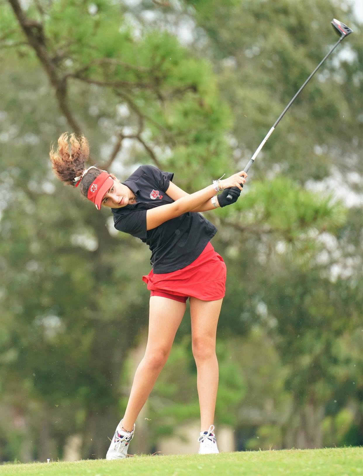Vero Beach's Dounia Bezzari tees off on the first hole at Meadowood Golf and Tennis Club during the Treasure Lake Conference Championships on Monday, Oct. 9, 2023 in Fort Pierce.