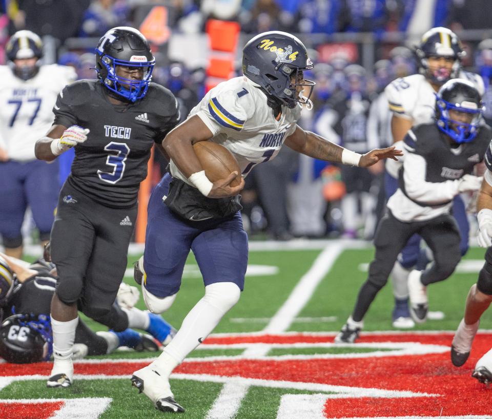 Toms River North's Micah Ford picks up yardage against Passaic Tech in the NJSIAA Group 5 championship game at SHI Stadium in Piscataway, N.J. on Nov. 27, 2023.