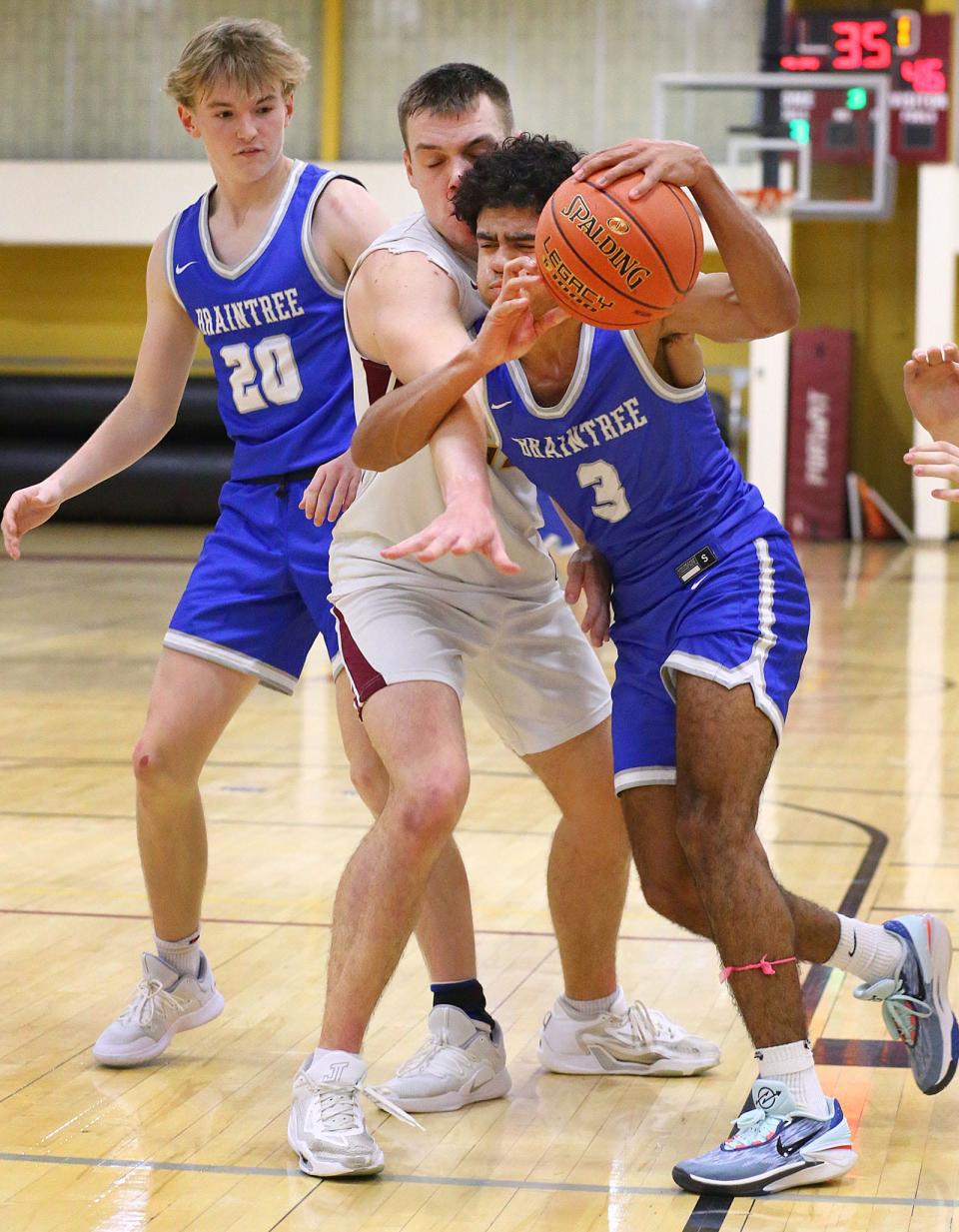 Braintree's Theo Moore gets fouled on his way to the basket. Weymouth hosts Braintree in their Christmas basketball tournament finale on Friday Dec. 29, 2023