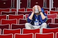 A fan reacts after the men's quarter-finals ice hockey game between Russia and Finland at the Sochi 2014 Winter Olympic Games February 19, 2014. REUTERS/Mark Blinch