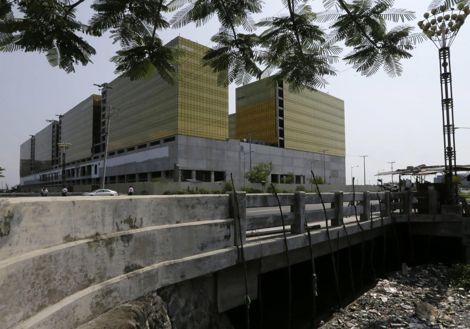 In this photo taken on Thursday, Sept. 6, 2012, construction continues at the Belle Grande building that would house casinos in a $4-billion project on a reclaimed land on Manila Bay in Manila, Philippines. In South Korea, foreign investors are scheduled to break ground next year on a clutch of casino resorts offshore. And on the eastern edge of Russia, authorities plan a resort zone aimed at drawing Chinese high-rollers. The projects are part of a casino building boom rolling across Asia, where governments are trying to develop their tourism markets to capture increasingly affluent Asians with a penchant for gambling. (AP Photo/Bullit Marquez)