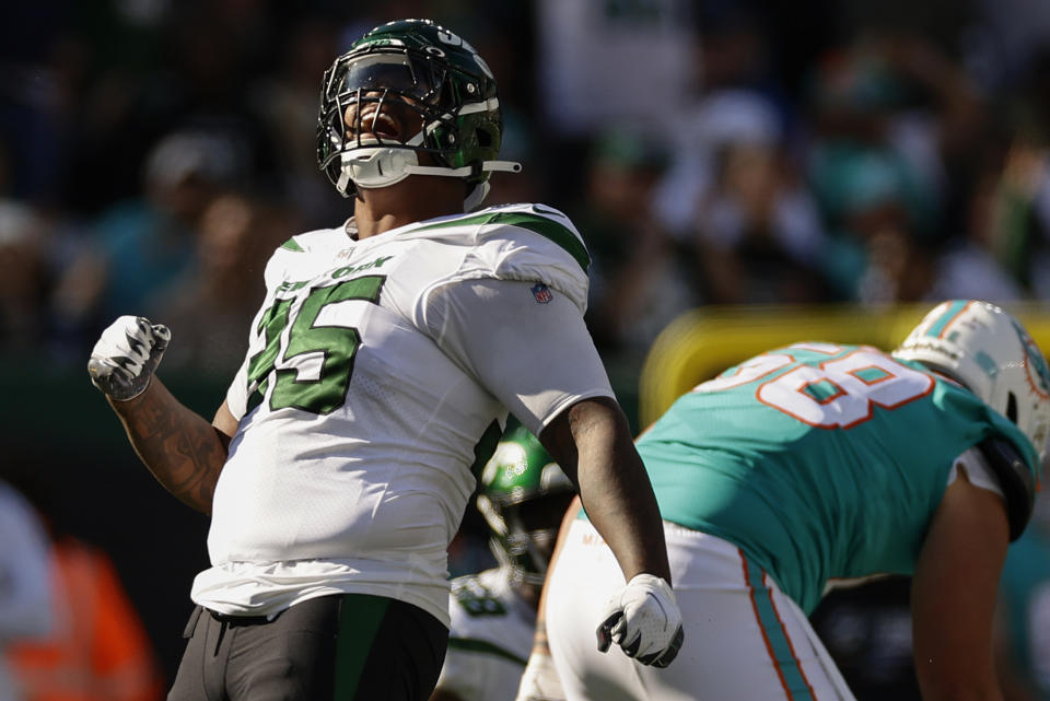 New York Jets defensive tackle Quinnen Williams (95) reacts after a defensive stop during the third quarter of an NFL football game, Sunday, Oct. 9, 2022, in East Rutherford, N.J. (AP Photo/Adam Hunger)