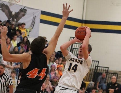 Jackson Iocoangeli of Erie Mason, shown shooting over Summerfield’s Zack Stambaugh, scored a career-high 21 points during his first start Thursday night.