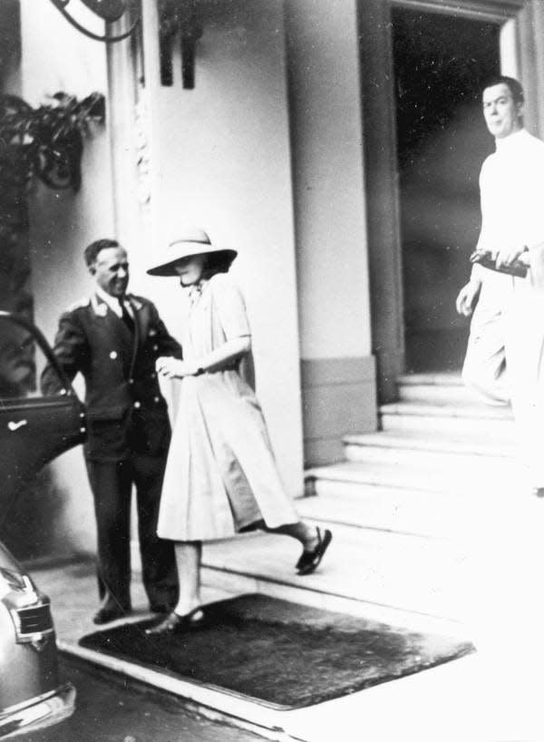Actress Greta Garbo leaves the Whitehall Hotel, the former residence of oil baron Henry Flagler, now restored as a museum.