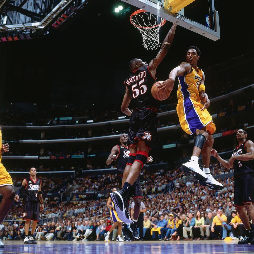 Bryant throws a&nbsp;pass around the back of the Philadelphia 76ers'&nbsp;Dikembe Mutombo during Game 2&nbsp;of the 2001 NBA Finals, on June 8, 2001, at the Staples Center.