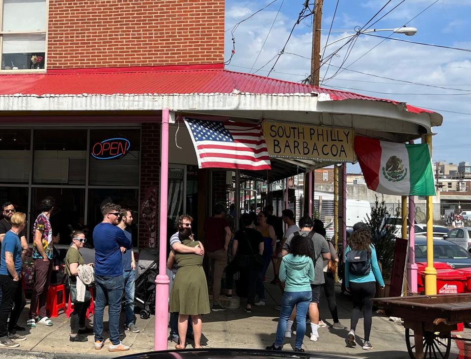 Lines extending down the sidewalk outside taqueria South Philly Barbacoa on a sunny Saturday in March 2022.