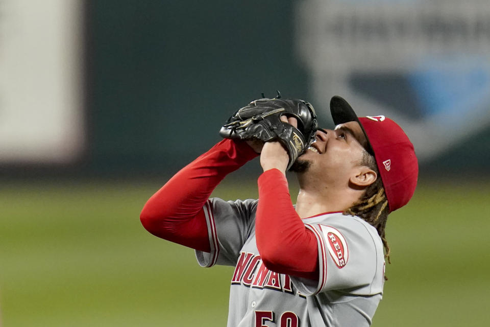 Cincinnati Reds starting pitcher Luis Castillo celebrates after throwing a complete baseball game against the St. Louis Cardinals Friday, Sept. 11, 2020, in St. Louis. The Reds won 3-1. (AP Photo/Jeff Roberson)