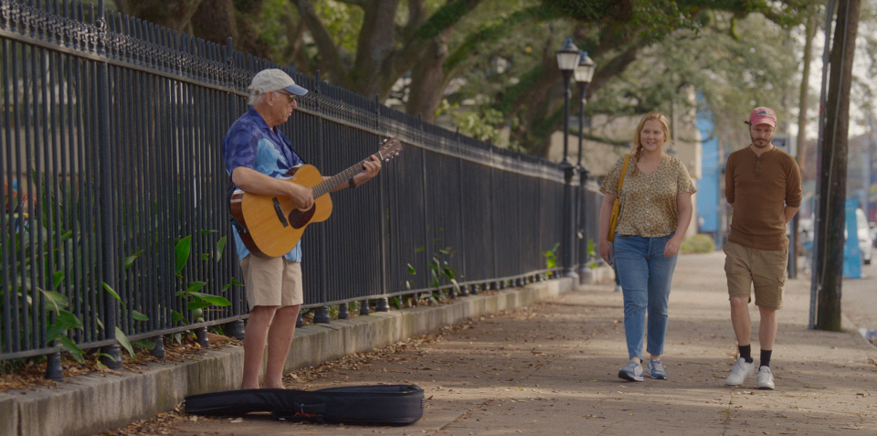 Jimmy Buffett makes a cameo as a busker in New Orleans where Beth (Amy Schumer) and John (Michael Cera) tie the knot.