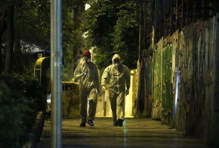 Forensics experts work at the scene after a bomb blast, in central Athens, Greece, April 19, 2017. REUTERS/Alkis Konstantinidis