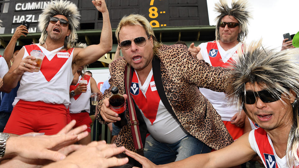 Warwick Capper poses with the 'Cappers' during the 2017 Ashes Series in Australia. (Photo credit should read WILLIAM WEST/AFP via Getty Images)