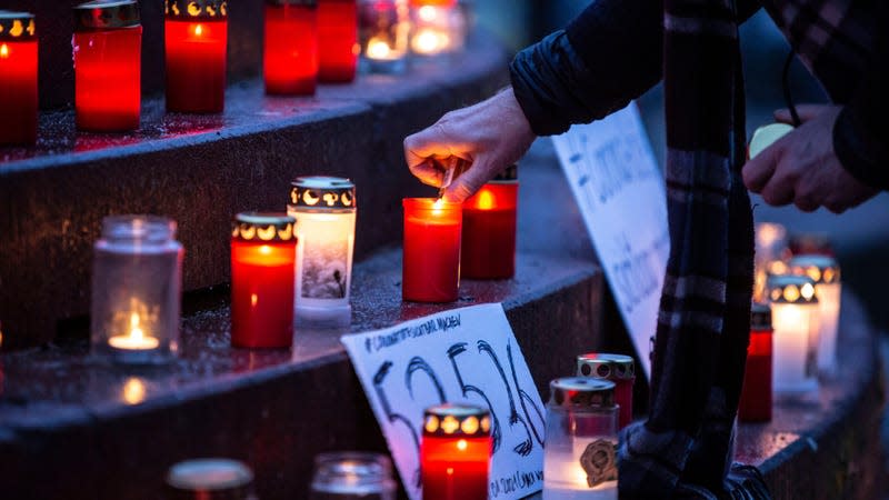  People attending a makeshift memorial for covid-19 victims at Arnswalder Platz on January 24, 2021 in Berlin, Germany.
