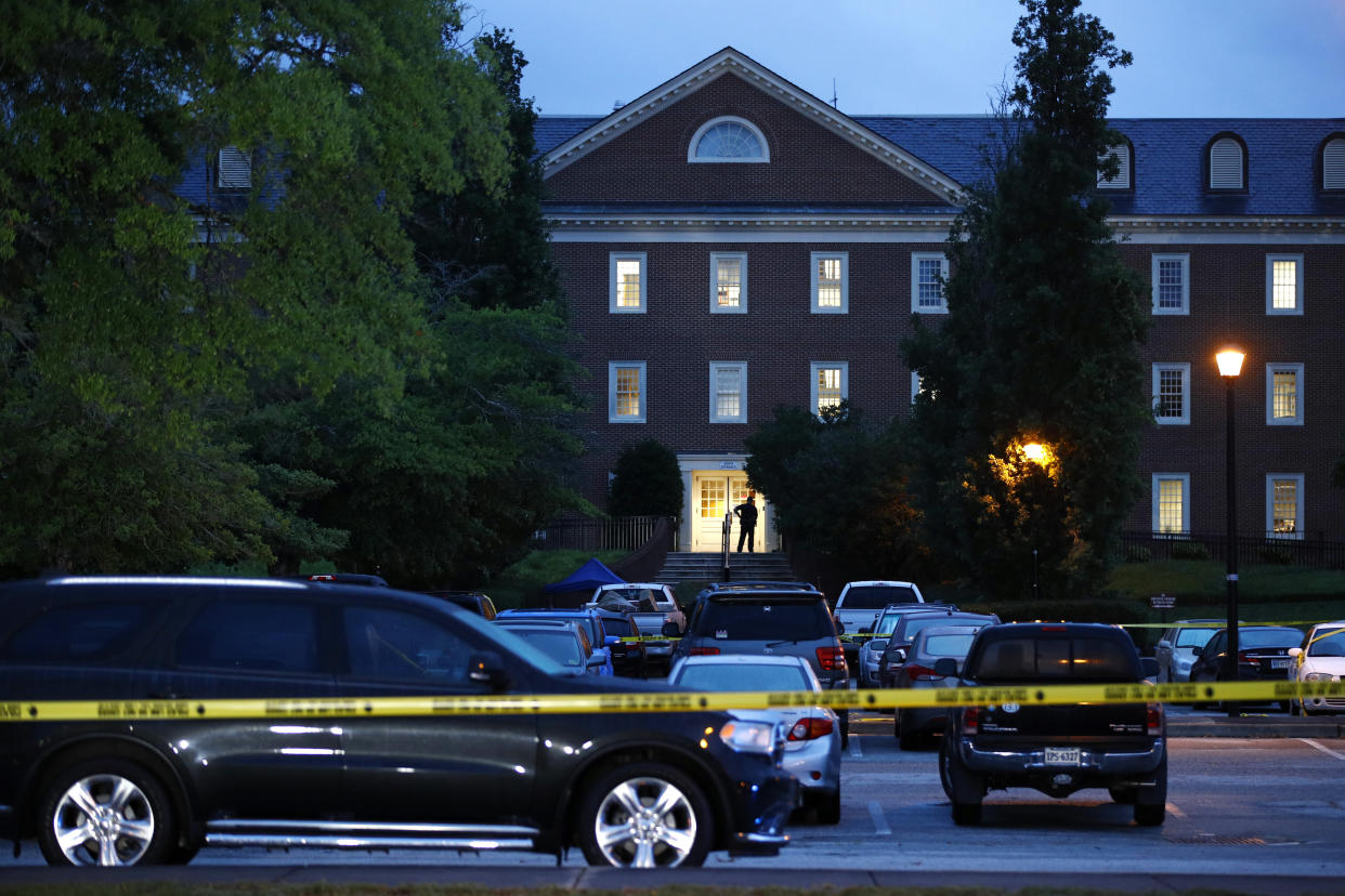 FILE - A law enforcement official stands at an entrance to a municipal building that was the scene of a shooting in Virginia Beach, Va., June 1, 2019. According to a letter dated Wednesday, Dec. 14, 2022, Virginia's attorney general has lambasted a state commission that is investigating a 2019 mass shooting in Virginia Beach, citing the panel's “overall dysfunction” and the resignation of nearly half its members. (AP Photo/Patrick Semansky, File)