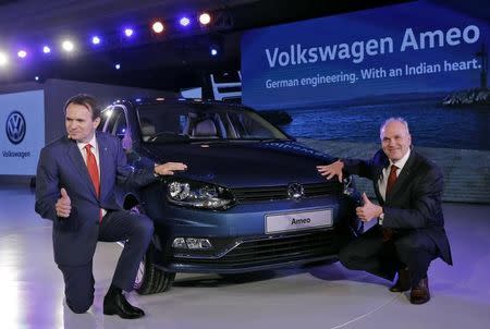 Member of the Board of Management of the Volkswagen Passenger Cars for sales and marketing, Jurgen Stackmann (R) and Volkswagen's director of passenger cars in India, Michael Mayer, pose next to a newly unveiled Ameo car during a news conference in New Delhi, India, February 2, 2016. REUTERS/Anindito Mukherjee