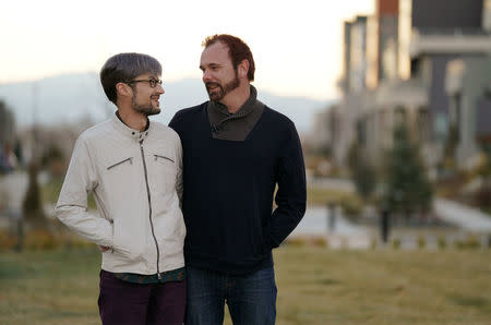 Gay married couple David Mullins (L) and Charlie Craig pose for a photo in Denver, Colorado, U.S. November 28, 2017. REUTERS/Rick Wilking