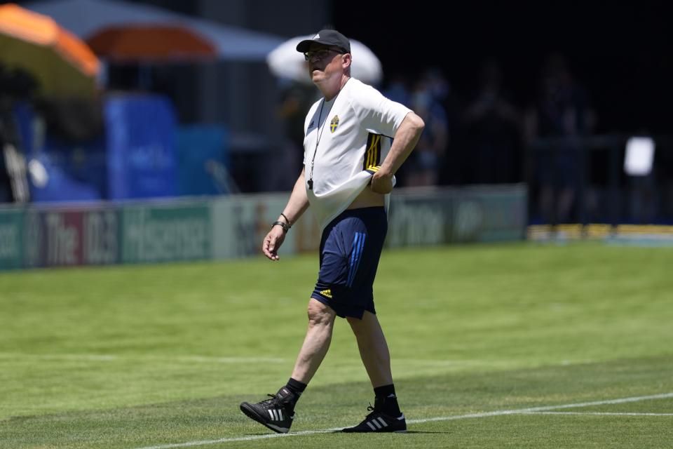 Sweden's manager Janne Andersson walks on the pitch during a training session at the La Cartuja stadium in Seville, Spain, Sunday, June 13, 2021. Sweden will play against Spain on Monday for the Group E of the Euro 2020 soccer championship. (AP Photo/Thanassis Stavrakis)