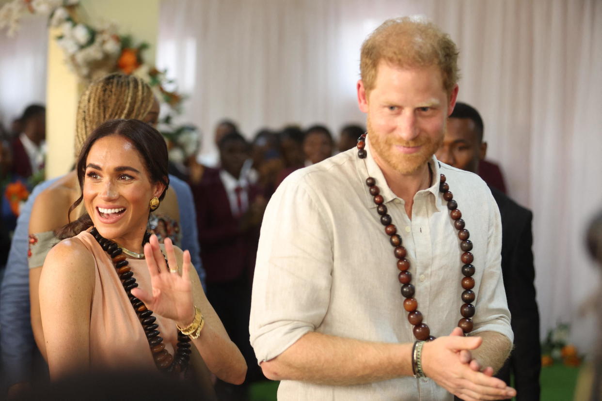 Britain's Prince Harry and Meghan, the Duke and Duchess of Sussex, arrive at the Lightway Academy in Abuja, Nigeria, May 10, 2024, as they begin a three-day tour of the African nation as part of celebrations of the Invictus Games. / Credit: KOLA SULAIMON/AFP/Getty