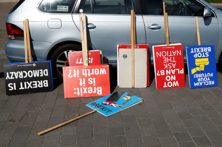 Anti-Brexit protesters' signs are leaned against a car outside the Houses of Parliament in London, Britain, May 23, 2019. REUTERS/Peter Nicholls