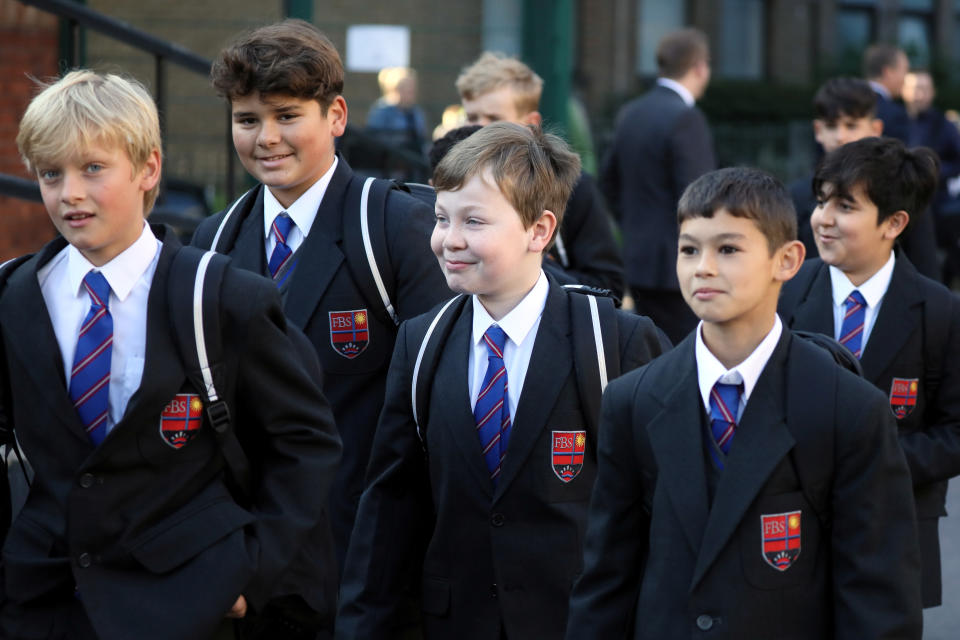 Pupils at Fulham Boys School return to school for the first time since March amid the spread of the coronavirus disease (COVID-19) in Fulham, south-west London, Britain September 2, 2020.  REUTERS/Kevin Coombs