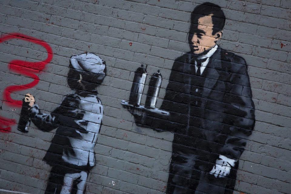 An installation by British graffiti artist Banksy is seen in the Bronx section of New York October 21, 2013. Known for his anti-authoritarian black-and-white stenciled images, which have sold at auction for upwards of $2 million, Banksy is treating New Yorkers to a daily dose of spray-painted art - while eluding the police and incurring the wrath of New York Mayor Michael Bloomberg. REUTERS/Eric Thayer (UNITED STATES - Tags: SOCIETY)