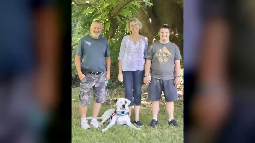 Medical Mutts service dog Patch meets his new family, from left, Arthur, Donna and Nic Mahanna.