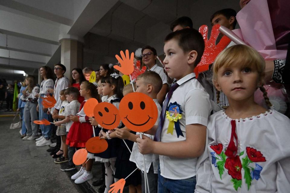 PHOTO: Pupils attend a ceremony held in a subway station to mark the beginning of the new school year, known as 'Day of Knowledge' in Kharkiv, Ukraine on Sept. 1, 2023, amid the Russian invasion of Ukraine. (Sergey Bobok/AFP via Getty Images)