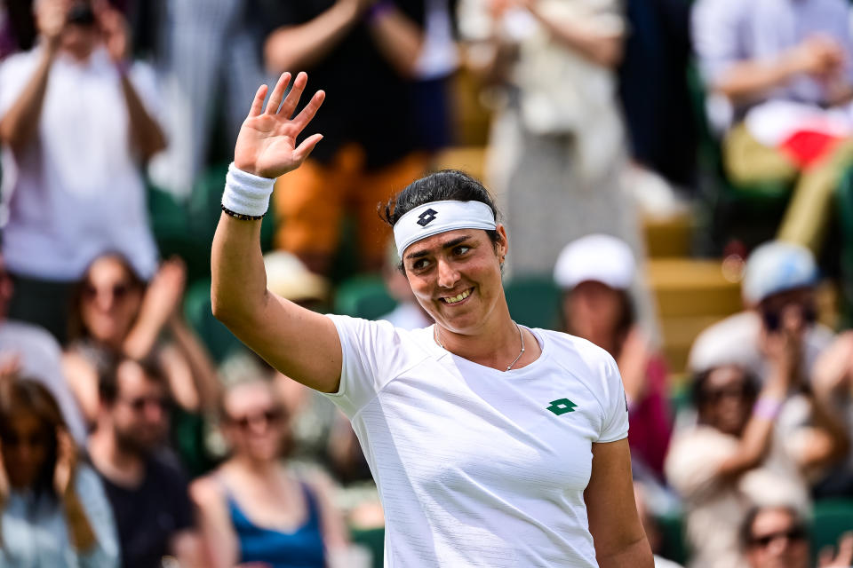 LONDON, ENGLAND - JULY 05: Ons Jabeur of Tunisia celebrates her victory over Iga Swiatek of Poland in the fourth round of the ladies singles during Day Seven of The Championships - Wimbledon 2021 at All England Lawn Tennis and Croquet Club on July 05, 2021 in London, England. (Photo by TPN/Getty Images)