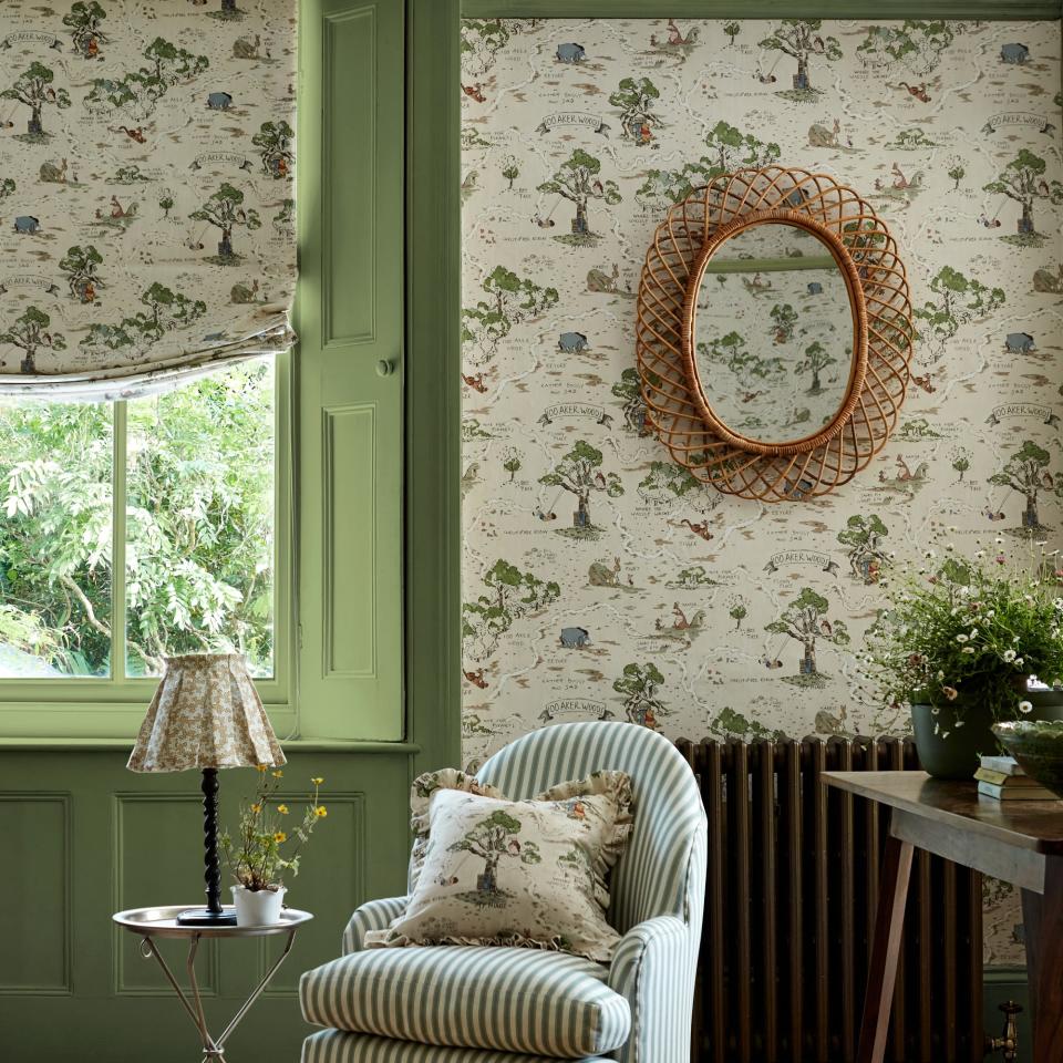 Disney-themed wallpaper in a living room with a striped chair