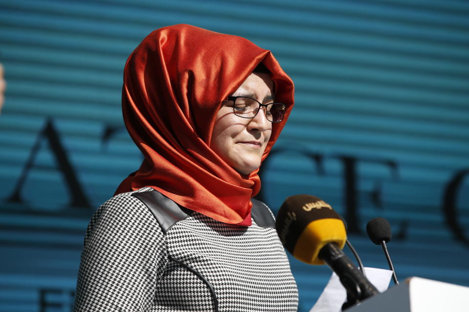 Hatice Cengiz, the fiancee of slain Saudi journalist Jamal Kashoggi, reacts as she delivers a speech at a ceremony near the Saudi Arabia consulate in Istanbul, marking the one-year anniversary of his death, Wednesday, Oct. 2, 2019. A vigil was held outside the consulate building Wednesday, starting at 1:14 p.m. (1014 GMT) marking the time Khashoggi walked into the building where ehe found tragic death. (AP Photo/Lefteris Pitarakis)