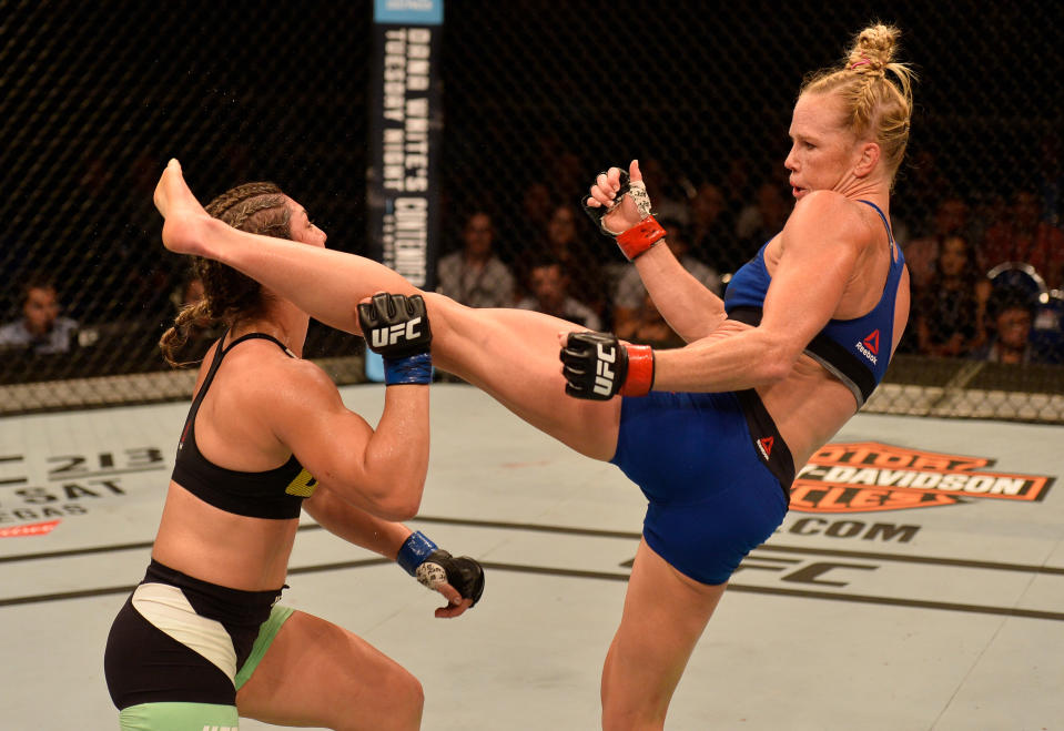 After three consecutive losses, Holly Holm (R) got back into the win column on June 17 by scoring a head-kick knockout of Bethe Correia in Singapore. (Getty Images)