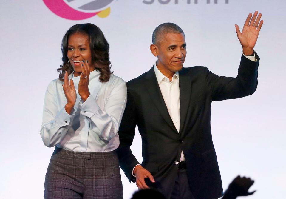 FILE - In this Oct. 31, 2017 file photo, former President Barack Obama, right, and former first lady Michelle Obama appear at the Obama Foundation Summit in Chicago. (AP Photo/Charles Rex Arbogast, File)