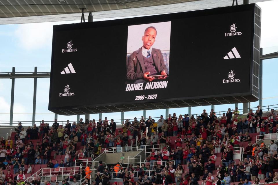 Daniel Anjorin’s face was displayed on a screen at the Emirates Stadium on Saturday (AP)