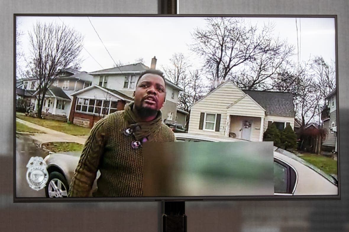 A monitor, displayed during a news conference at Grand Rapids, Mich., City Hall, on April 13, 2022, shows a video of a Patrick Lyoya during a traffic stop before he was fatally shot by a white police officer. (Grand Rapids Police Department, File)