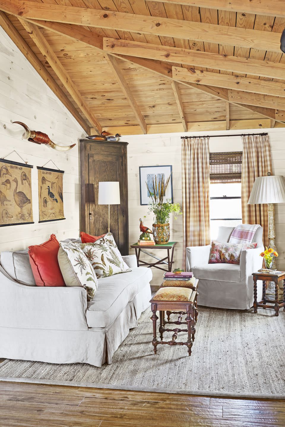 cabin living room with neutral upholstery and checked curtains