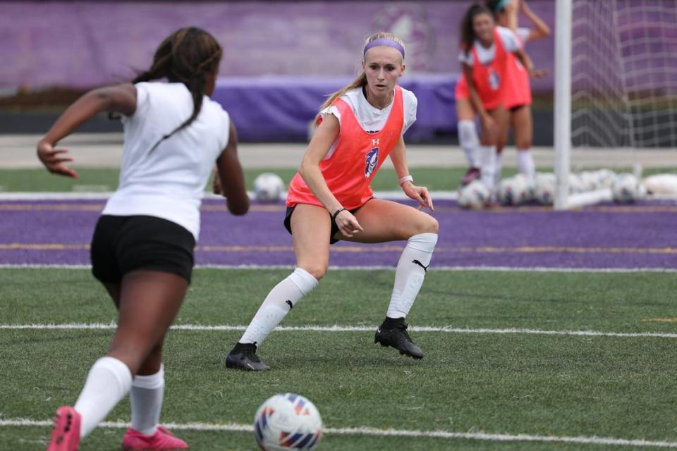 Audrey Kell’s defender Carly Montgomery, right, keeps her eyes on the ball during practice on Friday, March 12, 2023.