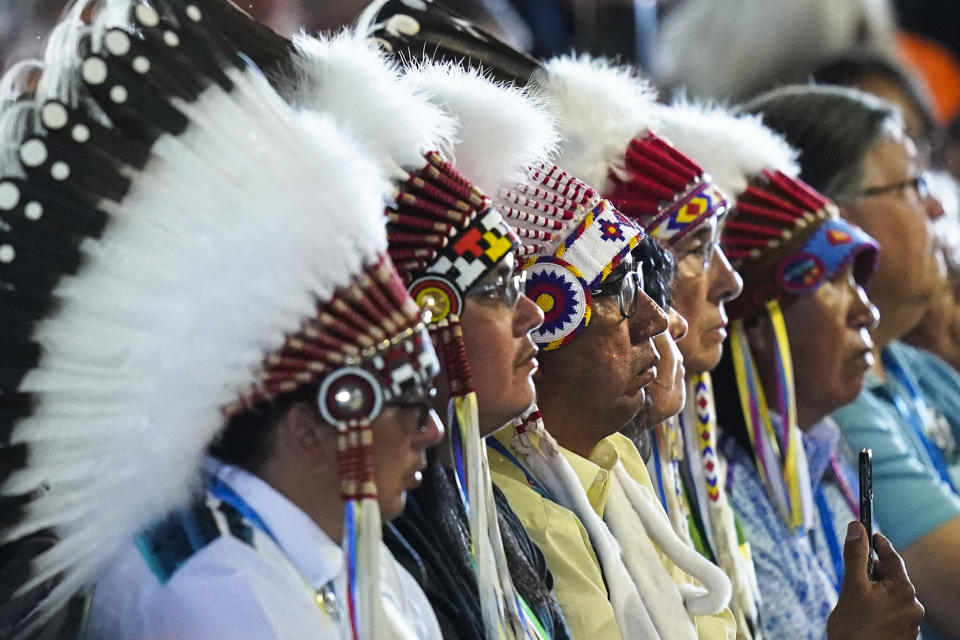 Indigenous chiefs listen to Pope Francis celebrates mass at the Lac Ste. Anne pilgrimage site in Alberta, Canada, Tuesday, July 26, 2022. Pope Francis traveled to Canada to apologize to Indigenous peoples for the abuses committed by Catholic missionaries in the country's notorious residential schools. (AP Photo/Eric Gay)